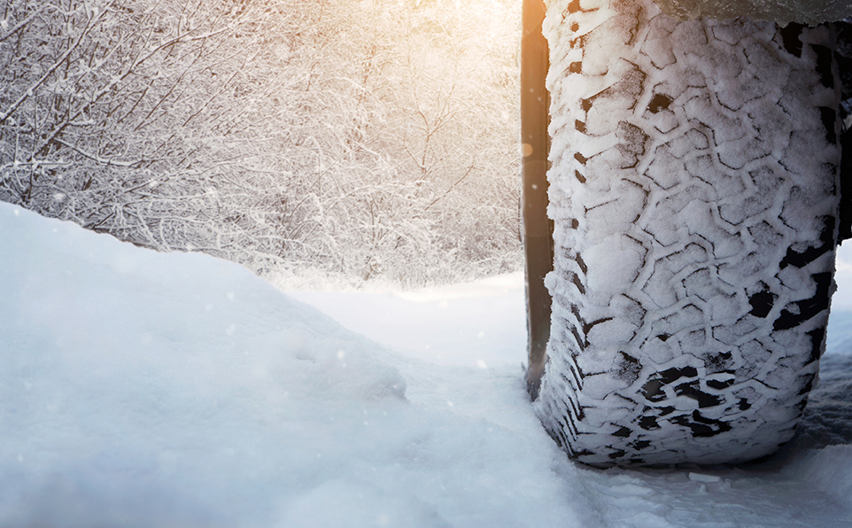 Car tire on the winter road